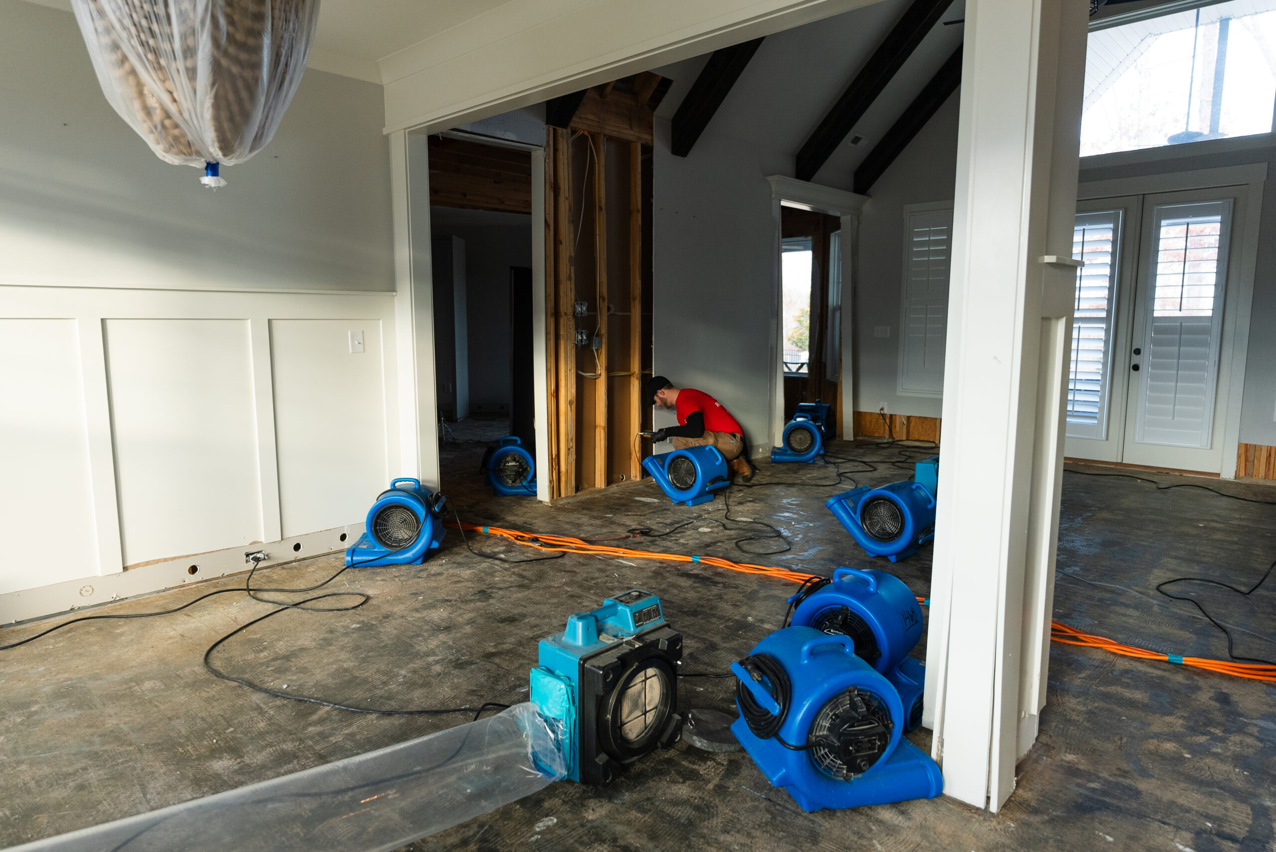 Water damage restoration technician inspecting a Sunrise Florida home